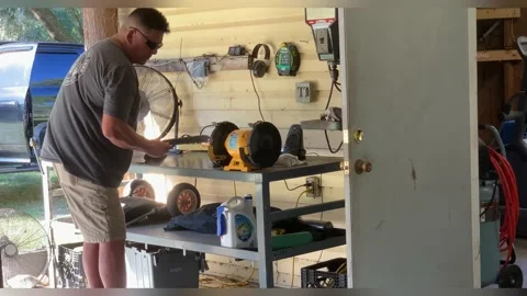 Native American Man Sharpening Machete Knife on Grinder 스톡 동영상 219394291