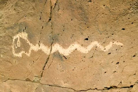 Native American petroglyphs featuring an image of a snake at Petroglyph National Stock Photos