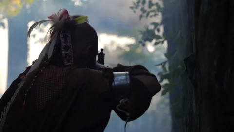 Native American Warrior in 18th C. Wildreness Battle with musket - portrayal Stock-Footage 137763526