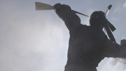 Native American Warrior celebrates an attack victory through smoke Video stock 93668438