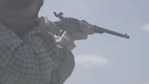 Native American Warrior Fires Rifle on the attack during 1800s Old West Stock Footage 93671471