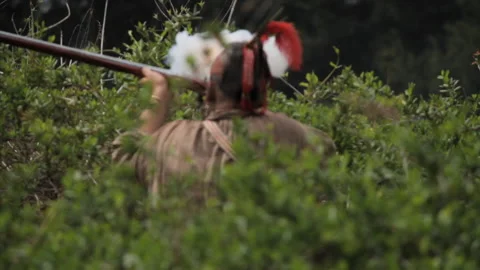 Native American Warrior Re-enactors fire flintlocks in wilderness re-enactment Stock Footage 172582633