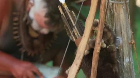 Native Indian Warrior knapping flint for arrows. Stone tools - portrayal Stock Footage 98782790