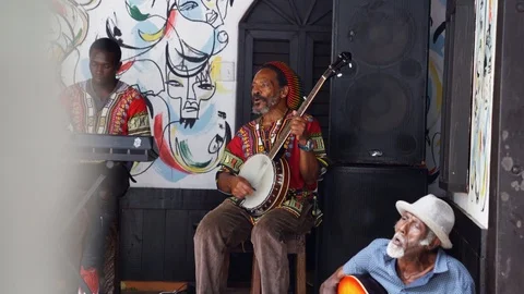 Native jamaicans playing bob marley in nine mile Stock Footage 123160093