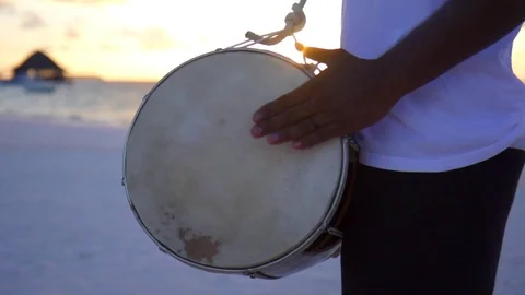 Native local men play drums and music at a tropical island resort hotel, slow mo Stock Footage