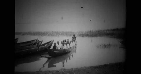 Native men of Uganda sitting in a boat Stock Footage 43447248