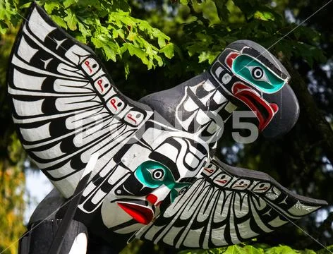 Native people totem pole. Handcrafted representation of unique culture. Stock Photos