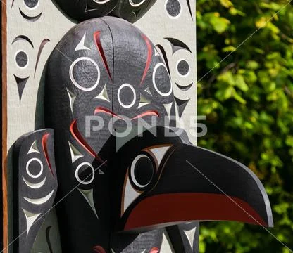Native people totem pole. Handcrafted representation of unique culture. Stock Photos