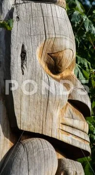 Native people totem pole. Handcrafted representation of unique culture. Stock Photos