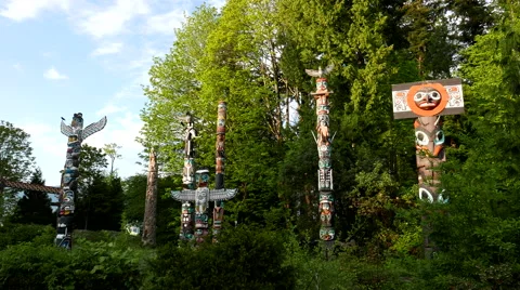 Native totem poles inside downtown Stanley Park Stock Footage 63603852