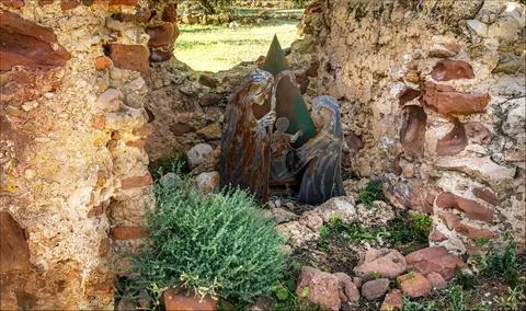 A nativity scene made of cut out metal characcters hidden in a broken buildin Stock Photos
