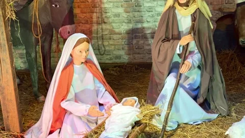 Nativity scene with Mary, Joseph and baby Jesus in Christmas manger display Stock Footage 339877280