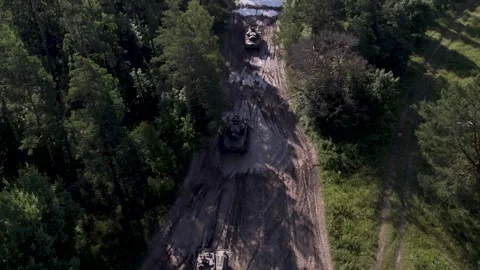 Nato armor splashing through mud Stock Footage 250980220