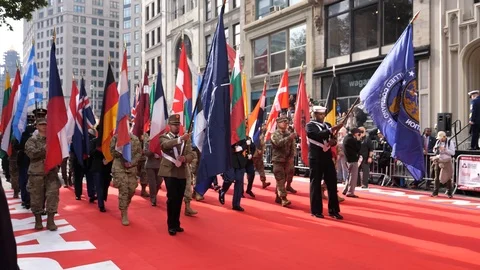 NATO Flags carried through the 2019 NYC Veterans Day Parade Stock Footage 119674067