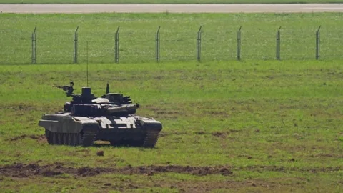 The NATO tank T-72 fire a shot with camera shaking during hot summer day Stock Footage 337203880