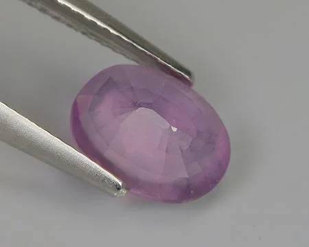 Natural amethyst on gray background Stock Photos