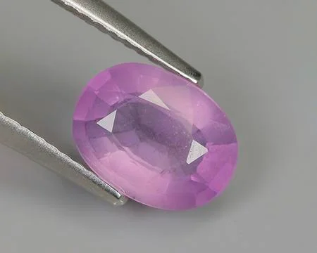 Natural amethyst on gray background Stock Photos