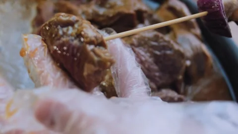Natural appetizing arrangement: draining marinated beef in a glass bowl Video stock 342181756