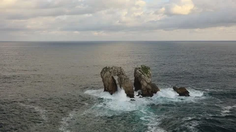 Natural arch of Playa de la Arnia at sunrise, Cantabria, Spain. Video stock 98468868
