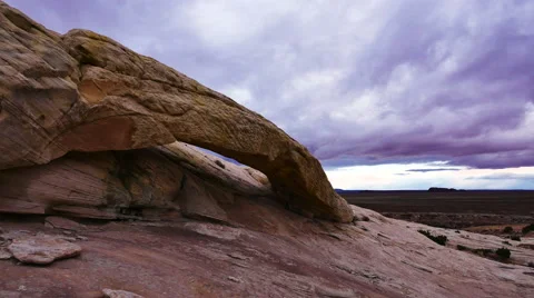 Natural Arch with Time Lapse Clouds Wilderness Adventure Moab Stock Footage 57499574