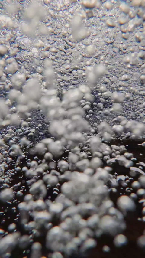 Natural background with air bubbles in water flow under water surface, slow Stock Footage 331610972