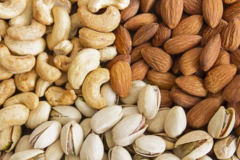 Natural background from mixed nuts. View from above. Stock Photos