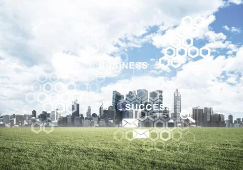 Natural background with modern cityscape green field and media i Stock Photos
