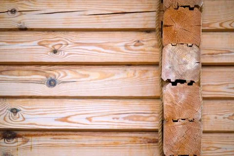 Natural background pattern of log wall. Construction of houses made of wood,  Stock Photos