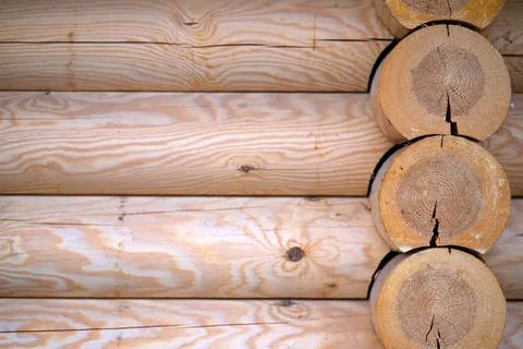 Natural background pattern of log wall. Construction of houses made of wood,  Stock Photos