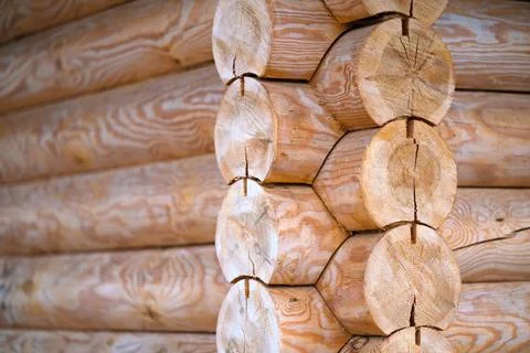 Natural background pattern of log wall. Construction of houses made of wood,  Stock Photos