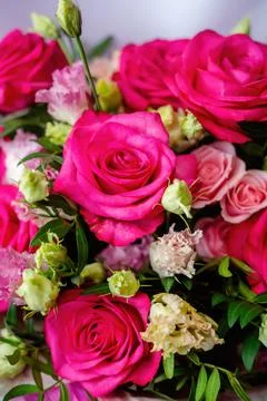 Natural background with raspberry rose and lisianthus Stock Photos