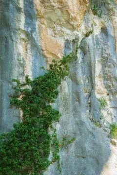 Natural background of solid rough stone wall Stock Photos