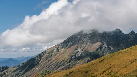 Natural background video timelapse in the mountains. Clouds form  Stock Footage 127943909