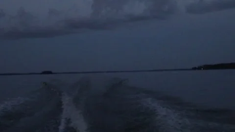 Natural background view of waves from a boat at sunset	 Video stock 280549604