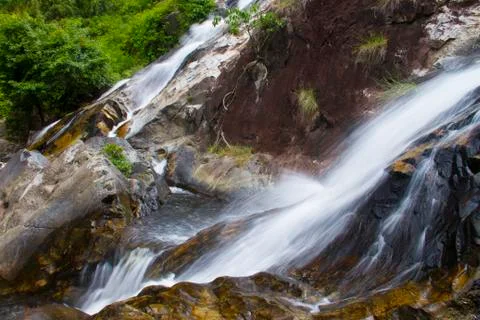 Natural background waterfall. Stock Photos