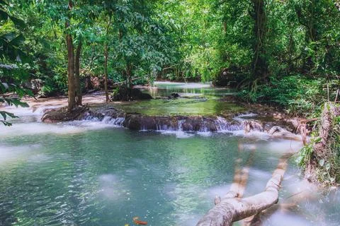 Natural background waterfall. Waterfall Emerald Pool, beautiful deep forest.. Stock Photos