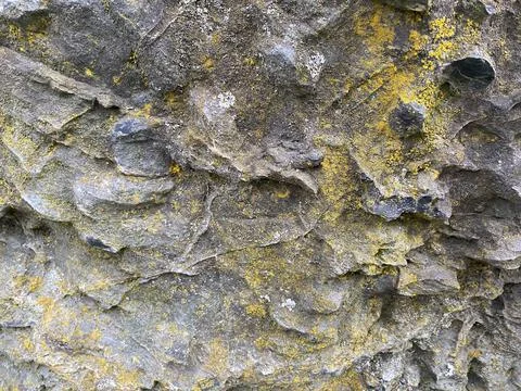 Natural beautiful textural sharp hard stone convex gray covered with dust and 스톡 사진
