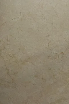Natural beige marble texture with subtle veins and patterns for interior design Stock Photos