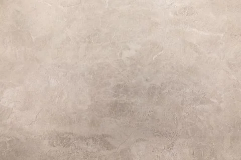 Natural beige stone surface with subtle textures and patterns suitable for Stock Photos