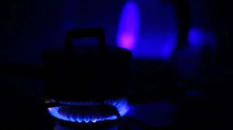 Natural blue gas loop in stove burner, soft focus in the dark Stock Footage 34034754