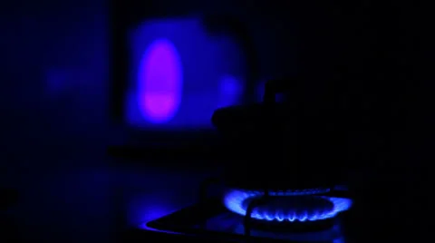 Natural blue gas loop in stove burner, soft focus in the dark Stock Footage 34034807
