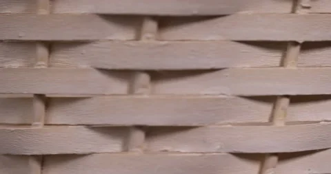 Natural branches painted white from which a decorative basket is woven, close up Stock Footage 312158158