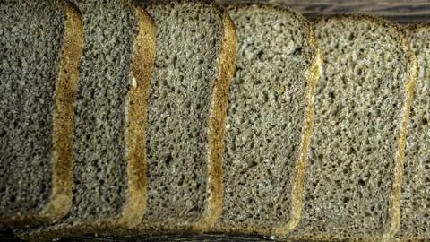Natural bread close-up, sliced ​​bread, black wheat bread. Stock Photos