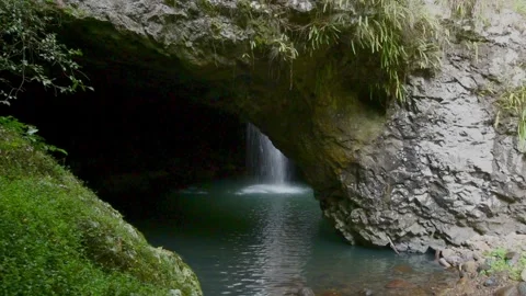 Natural Bridge, Springbrook NP, Australia. Waterfall in the roof of a cave. Stock Footage 250141215