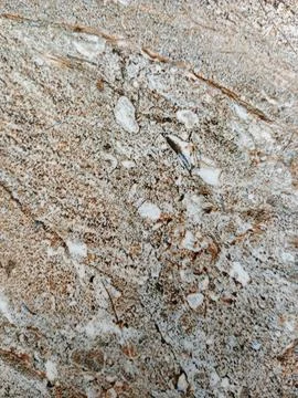 Natural brown granite stone texture background Stock Photos
