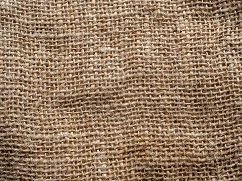 Natural brown rough woven burlap fabric textured background Stock Photos