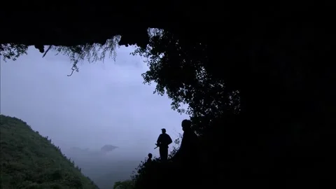 Natural cave in valley Video stock 261633459