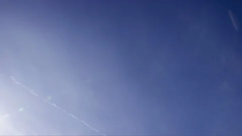 Natural Clouds Dissapate While Contrails / Chemtrails Remain Stock Footage 99557979