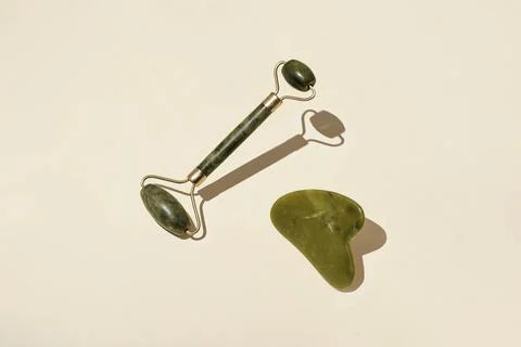 Natural crystal massage roller for self-care. Spa tool. Stock Photos