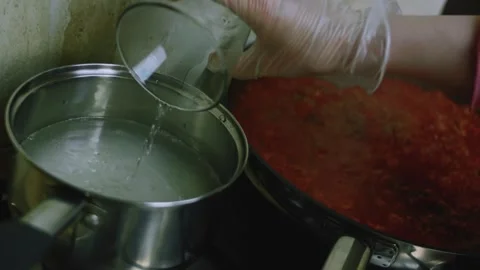 Natural culinary study of fluffing cooked white rice with a spoon Stock Footage 342153459